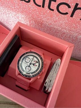 Omega Pink Chronograph Watch with White Dial and Black Bezel